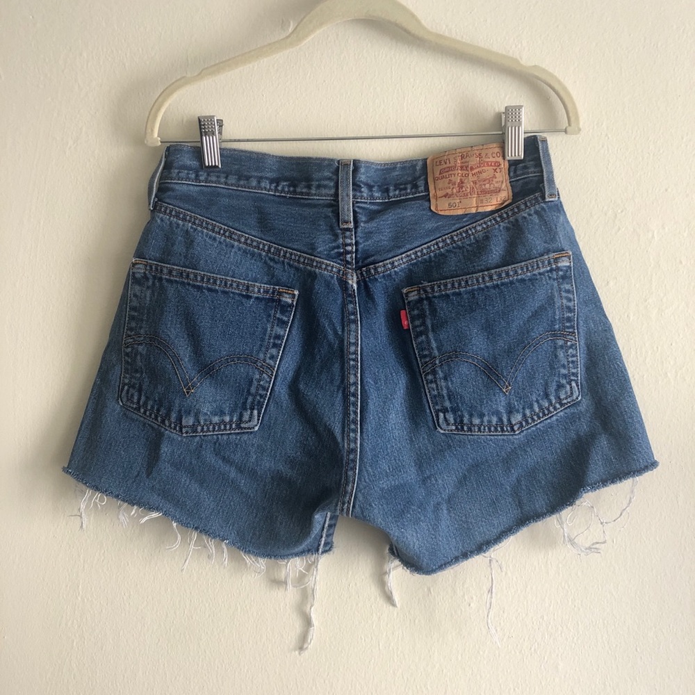 Vintage Levis 501’s midwash shorts with raw hem